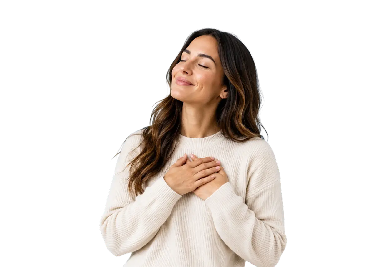 Woman in a white sweater with closed eyes, smiling, and hands on chest, expressing contentment.